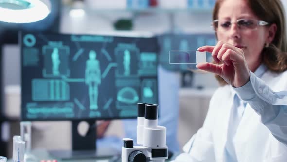 Woman Scientist Holds a Biological Sample