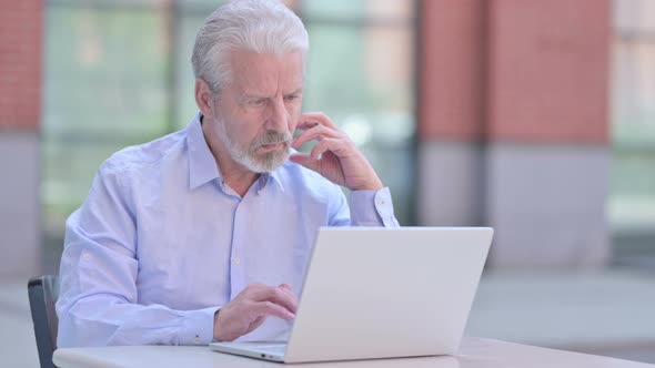 Outdoor Thinking Old Man Working on Laptop