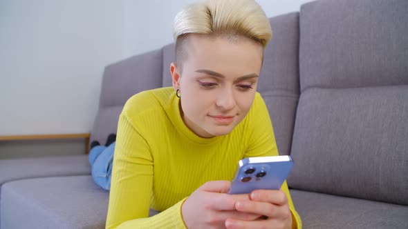 Cheerful white woman using mobile phone for communication during lockdown in 4k video