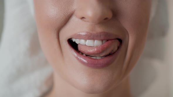 Close up video of woman showing full smile. Shot with RED helium camera in 8K.