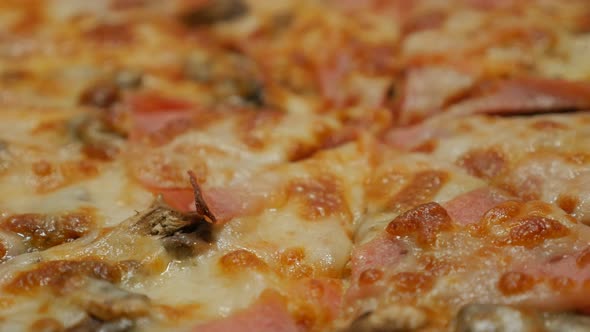 Shallow DOF tasty gourmand  pizza on table 4K 2160p 30fps UltraHD footage - Slow panning over tasty 