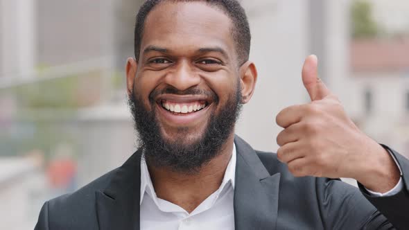 Millennial Bearded Black Young Male Businessman Boss Showing Thumb Smiling Demonstrates Satisfaction