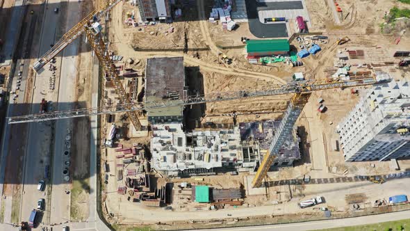 Aerial View Tower Cranes Working on Construction Site in City