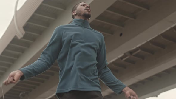 Black Man Jumping Skipping Rope Outdoors