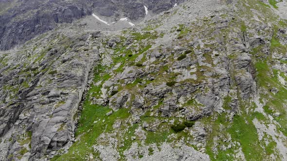 AERIAL: Steep Side of a Mountain covered with Green Grass in Slovakia