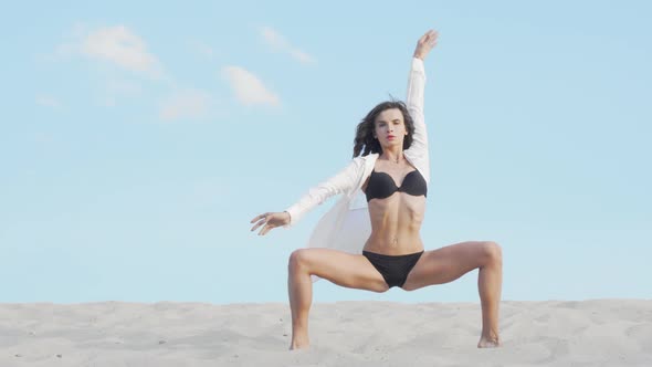 Beautiful Female Dancer Performing Outdoors in the Desert