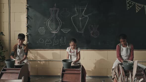 Little Students Using Pottery Wheels