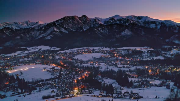 Sunset over snowy Zakopane in winter, aerial view