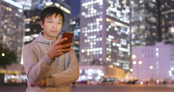 Man use of mobile phone at night 