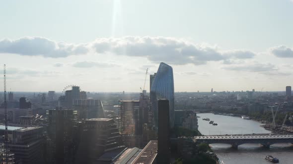 Slide and Pan Shot of Tall Modern One Blackfriars Skyscraper on Waterfront at Bridges Across Water