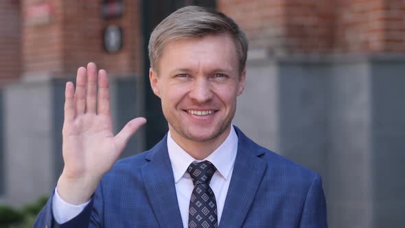 Hello, Businessman Waving Hand to Welcome