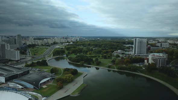 Flight over the city in cloudy weather.