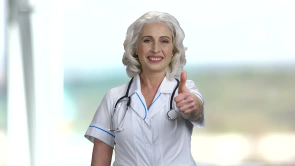 Senior Woman Doctor Showing Thumb Up.
