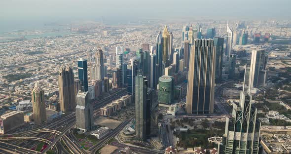 Panoramic view of Dubai skyline from Burj Khalifa tower skyscraper. Time lapse