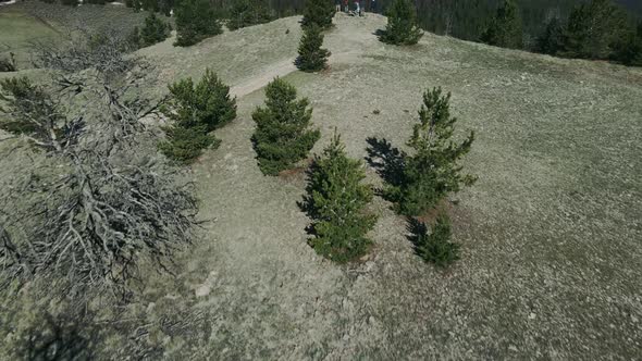 group of people hiking on top of a cliff in wyoming