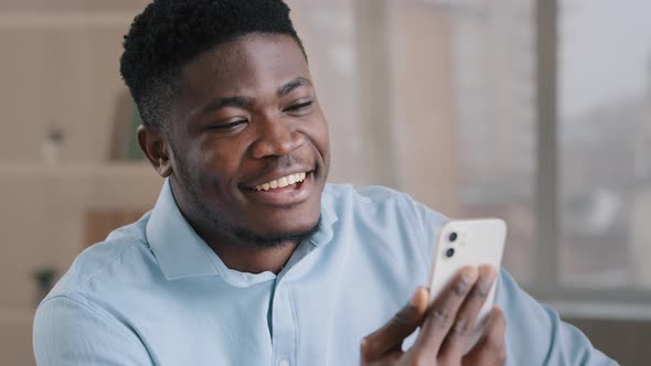 Happy Young African American Guy Businessman Handsome Entrepreneur Man Worker Hold Smartphone Talk