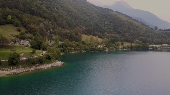 Picturesque coastline of Lake Ledro in Northern Italy at dawn, aerial view