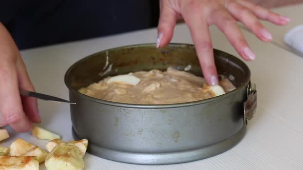 A Woman Makes An Apple Pie. Cooking Charlotte At Home. Shooting From The Camera On The Slider.