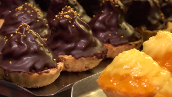 Closeup on Fruit and Chocolate Cupcakes on Metallic Trays