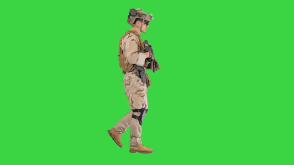 Armed Marine Soldier with Rifle Walking on a Green Screen, Chroma Key