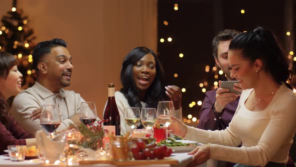 Friends Having Christmas Dinner and Taking Selfie