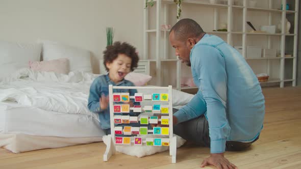 Dad Teaching Son Alphabet with Educational Abc Toy