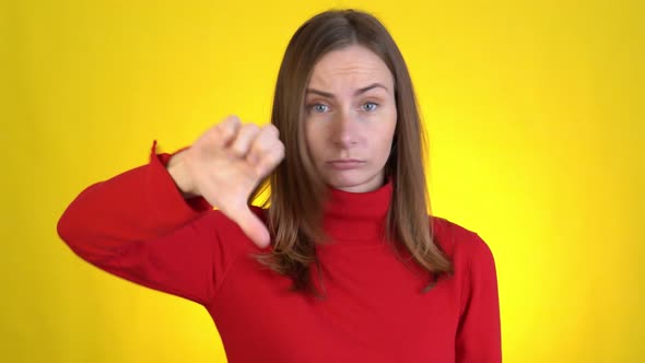 Displeased Worried Young Woman Posing Isolated on Yellow Background Studio