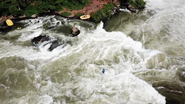Drone view of a kayaker descending the Nile River waterfalls in Jinja, Uganda. Victoria Lake