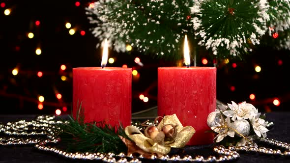 Two Red Candles with Christmas Decorations and Tree on Black, Bokeh, Light, Garland, Rotation