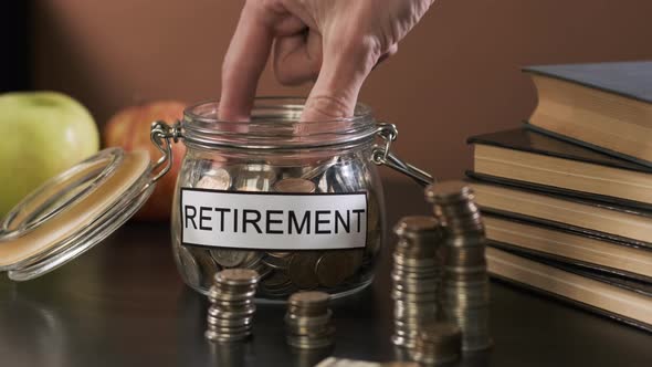 Closeup of Man Takes Savings From Glass