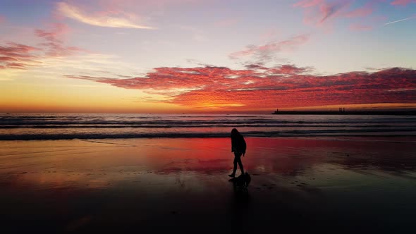 People on Beach at Sunset