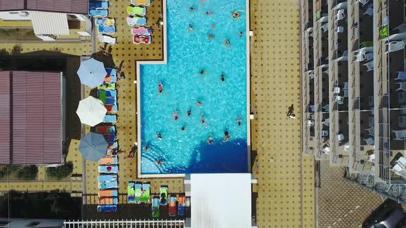 People doing water aerobics in a pool of a resort. Tourists on holiday