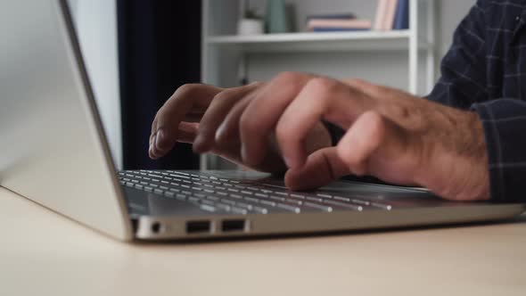 Young Man Hands Typing on Keyboard Closeup