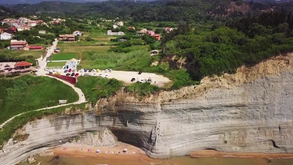 Greece, Corfu Island, drone footage of a beautiful cliff. Backwards flight.