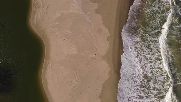 Aerial View of Sandy Beach and Sea Waves