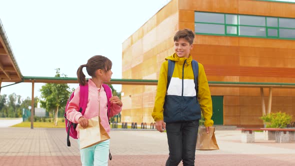 Children with Backpacks Going To School