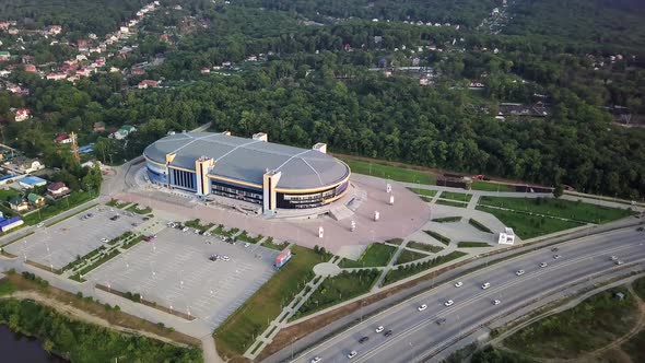 Drone View of the Fetisov Arena Sports Complex Surrounded By Green Hills