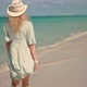 Woman Relaxing On Bahamas Flowing Dress Blowing In Wind.Travel Mood Wind Blows Dress On Ocean Resort - VideoHive Item for Sale