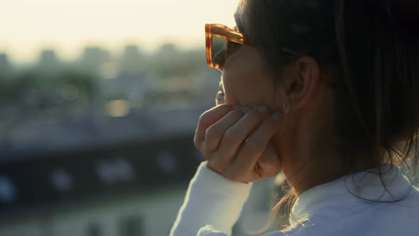 Caucasian young woman enjoying the sunlight on her face. Shot with RED helium camera in 8K.