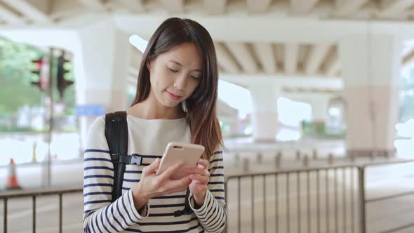 Woman use of mobile phone at street