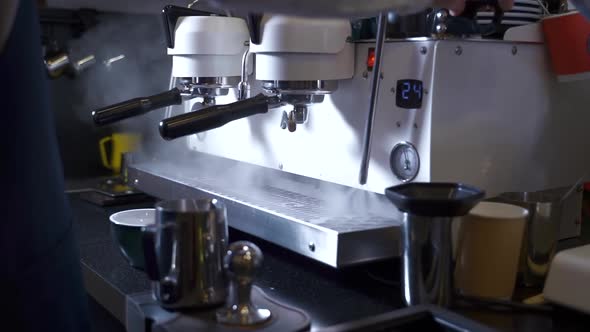 Barista Makes Coffee in Professional Machine in Restaurant Kitchen Spbas