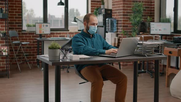 Portrait of Entrepreneur Wearing Face Mask at Office Job