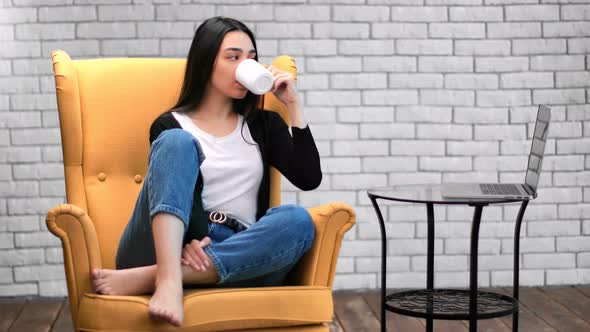 Domestic Asian Woman Relaxing Drinking Tea Watching Movie Use Laptop