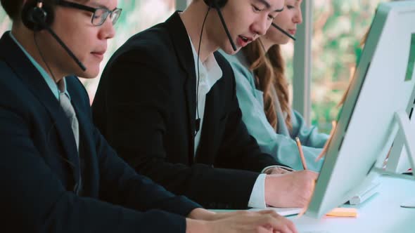 Business People Wearing Headset Working in Office