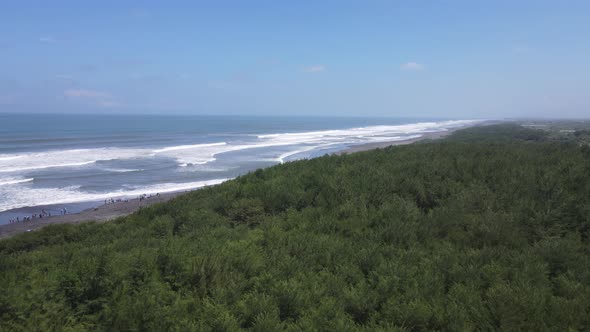 Aerial view of people holiday in parangtritis beach, Indonesia