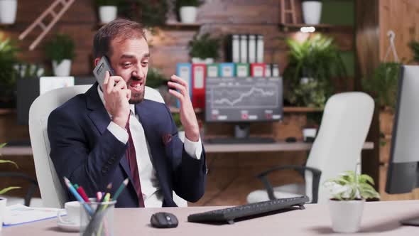 Slow Motion Footage of Angry and Stressed Businessman Screaming in the Phone