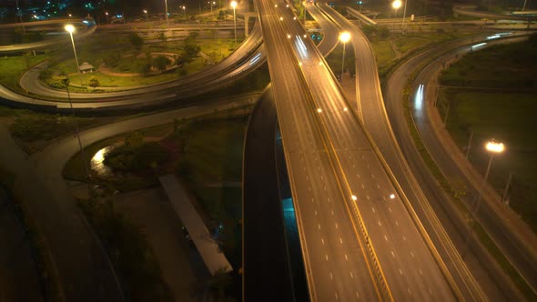 4K : Time lapse Aerial view and top view of traffic on city. Expressway with car lots