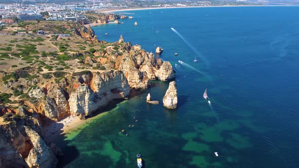 Drone shot of kayaks and boats passing around. Exploring caves and tunnels. Travel and adventure