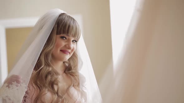 Beautiful and Lovely Bride in Night Gown and Veil, Wedding Morning, Slow Motion