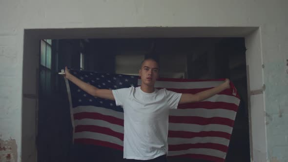 Fashionable young man in an abandoned warehouse